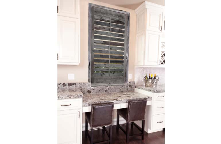 Kitchen window with reclaimed wood shutters in San Antonio